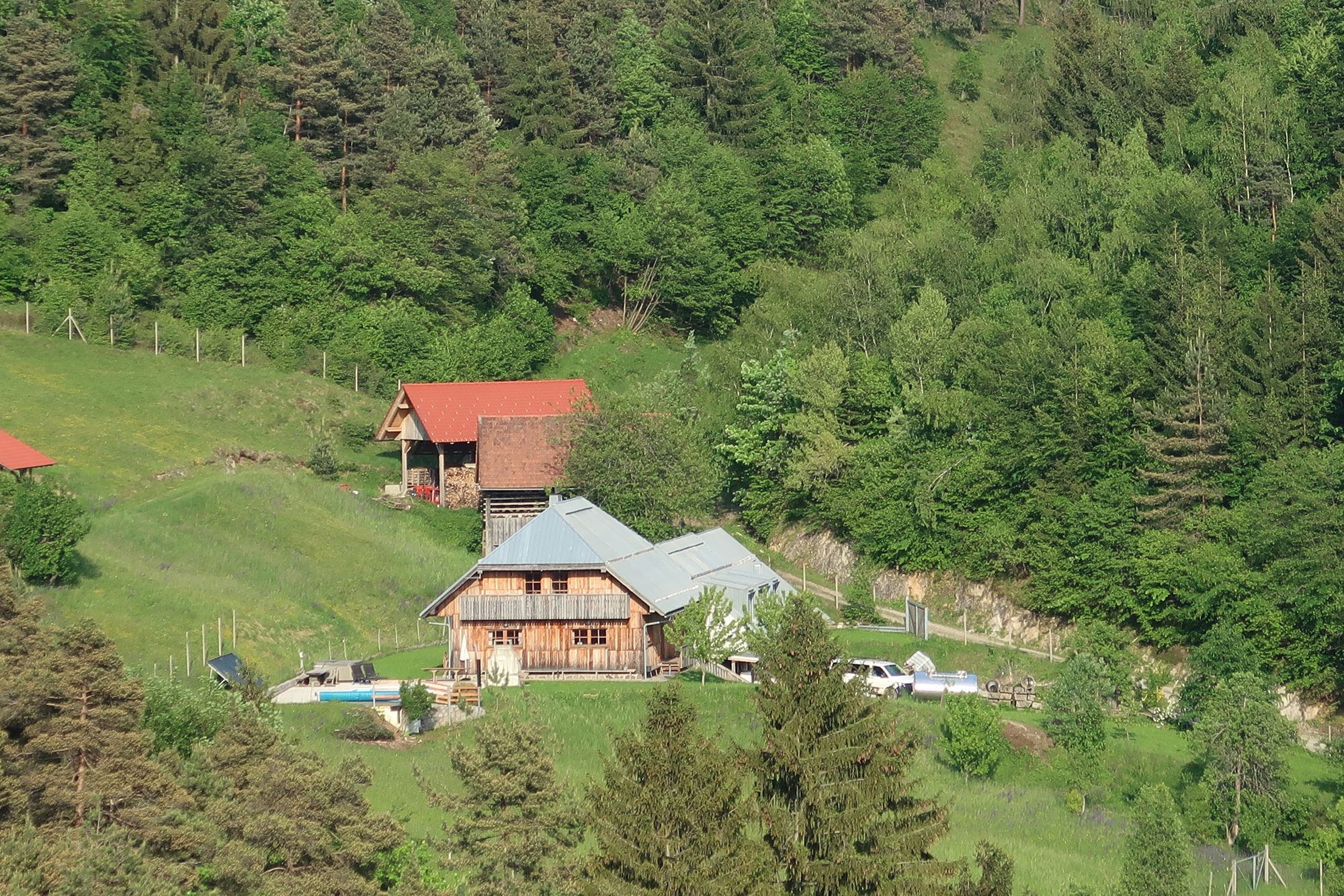 Forest Farmstay on a green hillside in the Polhov Gradec Hills